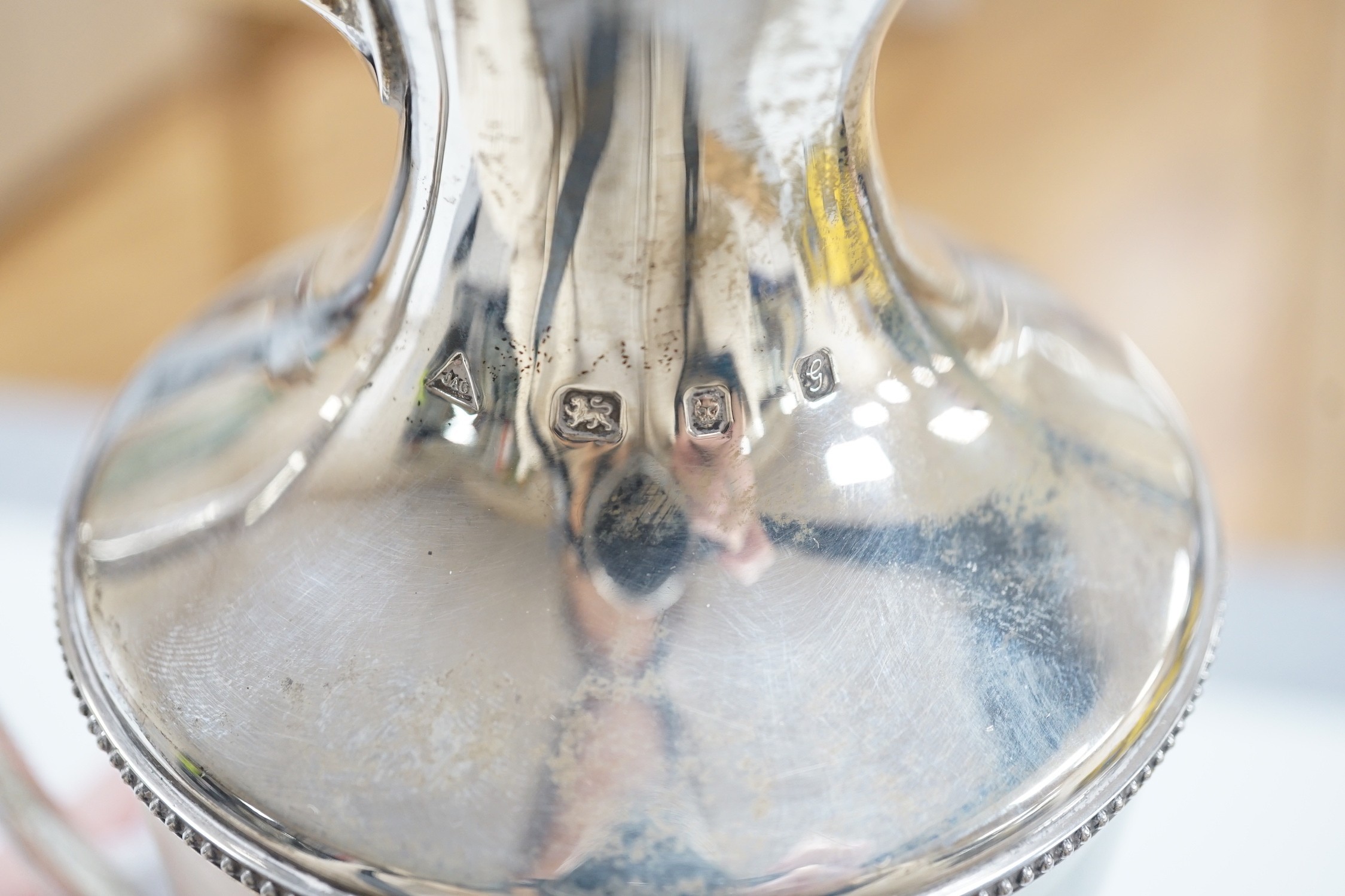 A modern silver mounted glass urn shaped claret jug, on pedestal foot, J A Campbell, London, 1981, 27.2cm.